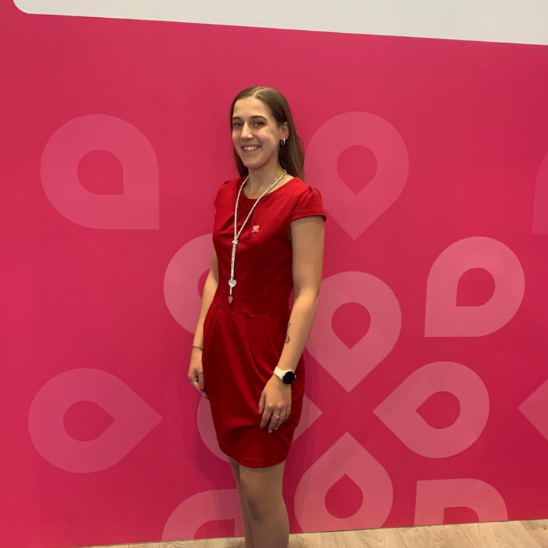 Lady smiling with pink background