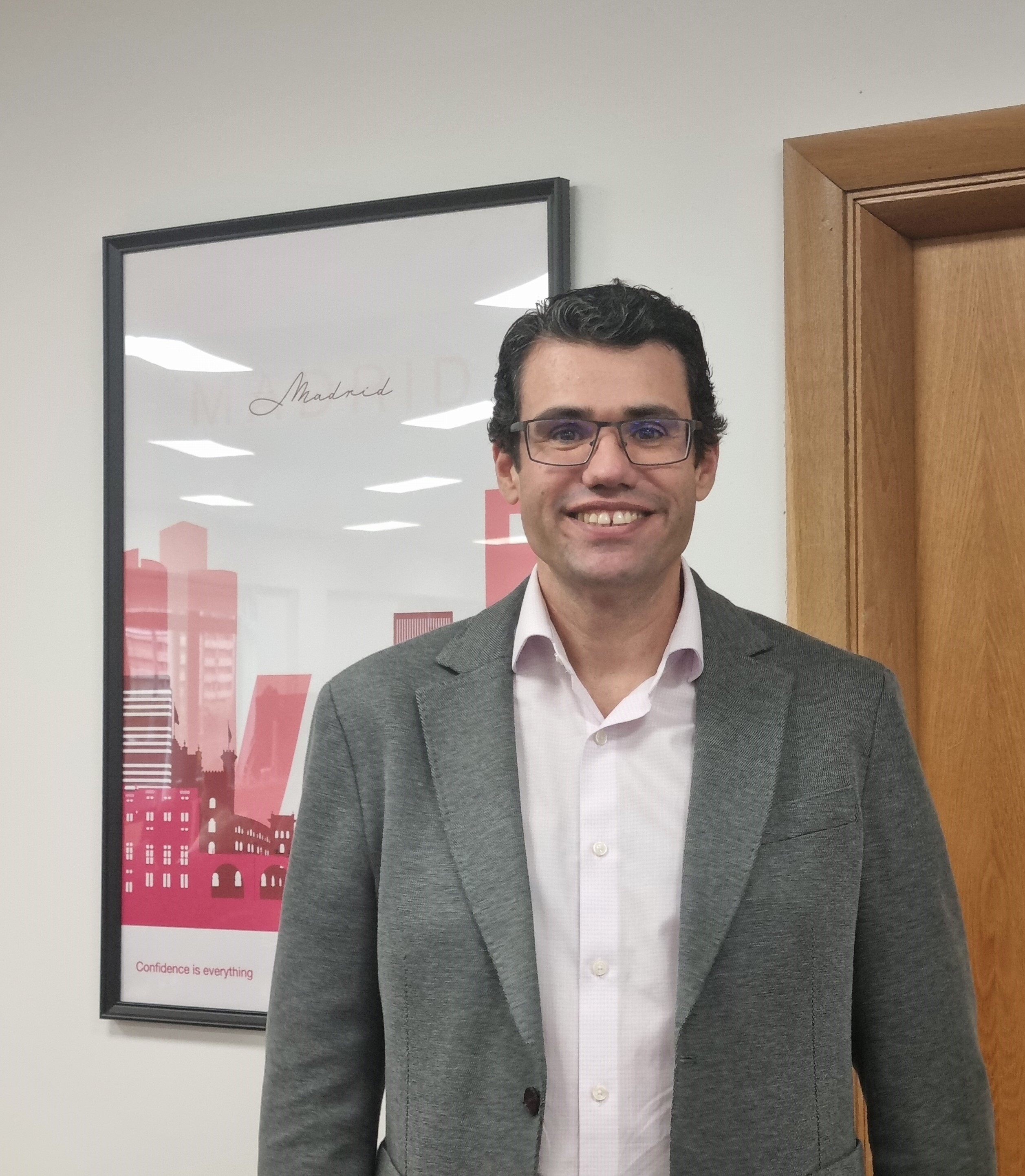 Man smiling in office